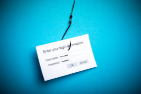 Image of login form on fishing hook representing phishing where hackers try to gain your personal information
