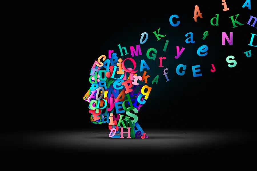 Reading comprehension and learning to read or language spoken and Autistic spectrum or Dyslexia disorder concept as a human head made of Alphabet letters as a symbol for education and mental health in a 3D illustration style.