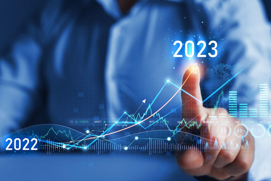 Business person draws increase arrow graph corporate future growth year 2022 to 2023. New Goals, Plans and Visions for Next Year 2023