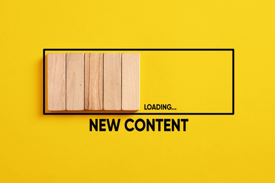 Uploading, downloading or updating new content concept. New content loading progress bar on yellow background.
