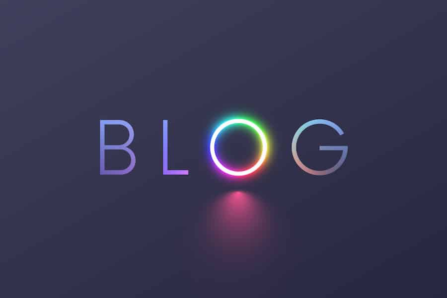 Blog on grey background. Concept logo blog with letter O in the form ring light or RGB circle lamp for video blogging. neon multicolor symbol of social media or vlog on dark grey. Social networks.
