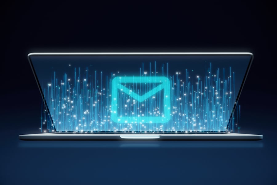 Laptop opening, revealing email icon