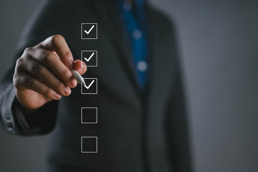 Business performance checklist, businessman using phone doing online checklist survey, filling out digital form checklist