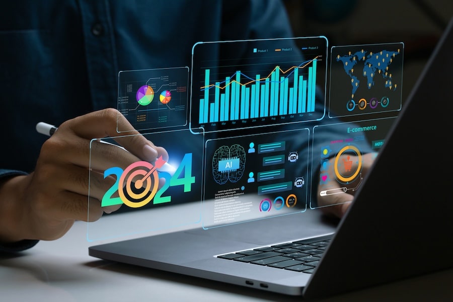 Businessman works on laptop Showing 2024 business trends dashboard with charts, metrics,  AI, E-commerce, KPI. analytical businessperson planning business growth 2024. 