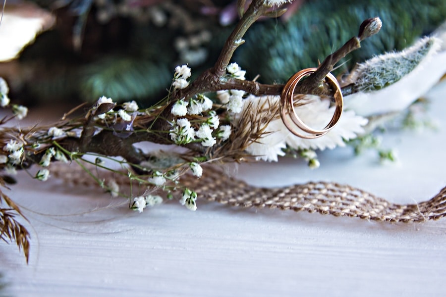 Wedding rings, wedding accessories in rustic style. invitation, bride’s wreath. Wedding accessories bride and groom.